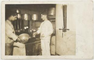 Az S.M.S. Babenberg osztrák-magyar hadihajó matrózai konyhai munkát végeznek a hajókonyhán, fotólap. / Two sailors toil over pots and pans in the S.M.S. Babenberg's galley. . .Black-and-white photo postcard