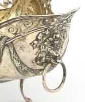 Ezüst (Ag) aufsatz. Domborított, pereménél áttört szalagminta zárja. Két oldalán domborított férfi p...