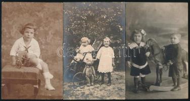 cca 1920 Gyerekek portréi, játék ágyúval, macival, hintalóval, 3 db fotólap. sérülésekkel, Nagyszeben, Kolozsvár, 13×9 cm