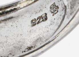 Ezüst (Ag) gyűrű kék kővel, jelzett, méret: 54, bruttó: 12,7 g