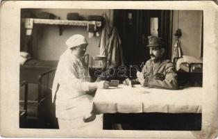 1917 Budapest, magyar katona és nővér kártyajáték közben az Andrássy úti hadikórházban / WWI Austro-Hungarian military hospital, soldiers and nurse playing cards. photo (EK)