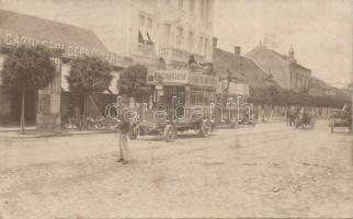 Arad with weapon store and doubledecker buses photo