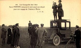 La Conquete de l'Air, Henri Farman mesurant le vent avant son départ pour son voyage de Chalons á Reims / Henri Farman - was a British-French aviator and aircraft designer and manufacturer - measuring the wind before flight