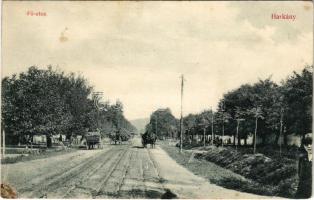 1911 Harkány, Fő utca, szekerek a kocsi nyomban járnak. Fürdőbazár kiadása (fl)