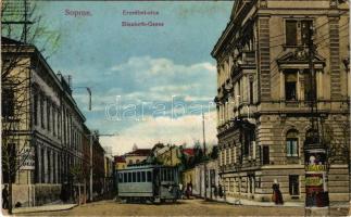 1915 Sopron, Erzsébet utca, villamos, "Vadászati kiállítás" és "Abadie" reklámja egy hirdetőoszlopon. Piri Dániel kiadása (EB)