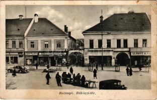 1941 Rozsnyó, Roznava; Rákóczi tér, gyógyszertár, Tátra drogéria, Bonton, Szántó A. és fia üzlete, piac, automobilok. Özv. Dr. Mariska Györgyné kiadása / square, pharmacy, drugstore, shops, market, automobiles (EB)