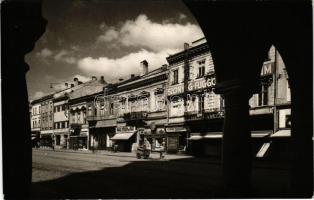 1943 Kassa, Kosice; utca, Corso illatszertár, drogéria, Kassai Takarékegylet M. Sz., MÁV hivatalos jegyiroda, Markovics szőnyeg-függöny, Gombos üzlete / street view, drugstore, savings bank, Hungarian State Railways ticket office, shops. Győri és Boros photo + "1938. november 11. KASSA HAZATÉRT - Cassovia Bélyegkiállítása 1943. XI. 14." So. Stpl.