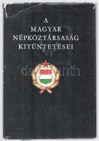 A Magyar Népköztársaság kitüntetései. Összeáll.: Besnyő Károly, Ruda Ilona. Bp., 1966., Közgazdasági és Jogi Könyvkiadó. Kiadói egészvászon-kötés, kissé kopott, kissé szakadt kiadói papír védőborítóban.