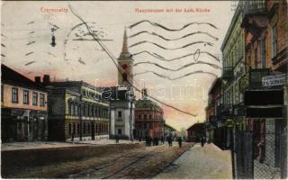 1909 Chernivtsi, Czernowitz, Cernauti, Csernyivci (Bukovina, Bucovina, Bukowina); Hauptstrasse mit der kath. Kirche, Apotheke / main street, Catholic church, pharmacy, shops of Hermann Grün, Haffner & Feuerstein, F.G. Schwarz. Verlag E. Kanarski (Rb)