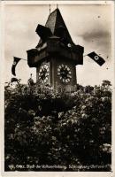 1939 Graz (Steiermark), Schlossberg-Uhrturm. Stadt der Volkserhebung / clock tower with Nazi swastika flags (cut)