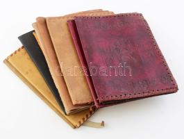 10 db dombornyomott mintás bőr könyvborító, közte Mátyás király portréjával és a Szent Márk-bazilika képével díszített, változó méretben és állapotban