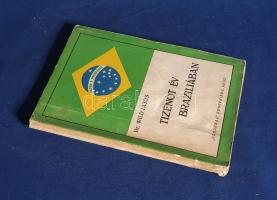 Wild Lajos:  Tizenöt év Brazíliában. Arad, 1936. "Vasárnap" Nyomdai Műintézet kiadása 1 t. (címkép) + 143 + [3] p. + 13 t. (kétoldalas). Egyetlen kiadás. Wild Lajos (1892-1960 után) orvos, gyógyszerész, 1922-től a brazíliai magyar konzulátus titkára. Trópusi betegségek ellen kifejlesztett fájdalomcsillapító gyógyszerét "Wild" néven szabadalmaztatta, a szabadalomért a brazil kormány magas rangú elismerésben részesítette. Brazíliai országismertető cikkei az aradi "Vasárnap" periodika hasábjain jelentek meg először, melyeket később kötetté szervezett. A címlapon régi tulajdonosi bejegyzés és bélyegzés, mely utóbbi a belív néhány oldalán megismétlődik. Példányunk fűzése kissé meglazult, néhány oldalon halvány foltosság. Színes, illusztrált, enyhén sérült, enyhén foltos kiadói borítóban. Jó példány, ritka könyv.