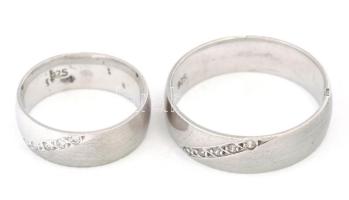 Köves ezüst (Ag) karikagyűrű pár, jelzett, m: 48, 62, bruttó: 8,2g