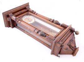 Falióra. Ingajáratos, réz súlyos, gazdagon faragott fa házzal. Szép porcelán számlappal. Jó állapotb...