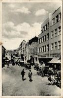 1938 Ungvár, Uzshorod, Uzhhorod, Uzhorod; Hotel Koruna. Ulice Dra Al. Rasina / Korona szálloda, utca, Bata cipőüzlet, Kovács üzlete, automobil / hotel, street, shops, automobile (EB)