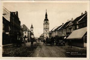 Nagyszombat, Tyrnau, Trnava; Masarykova ulica / Masaryk utca, gyógyszertár, üzletek, automobil / street, pharmacy, shops, automobile (kis szakadások / small tears)