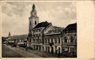 1938 Beregszász, Beregovo, Berehove; templom, Legiobanka, Hausmann Ch., Klein Mór, Rozner Izidor üzlete. Farkas és Földes kiadása / church, bank, shops + "Beregszász visszatért 1938" So. Stpl (kopott sarkak / worn corners)