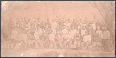 cca 1900-1910 Osztrák-magyar katonák csoportképe, köztük tábori lelkész, nagyméretű fotó, a ceruzával jelölt személy a hátoldali felirat szerint Georg Navratil (Navratil György?) főhadnagy, sérülésekkel, ázott, 19,5x39,5 cm