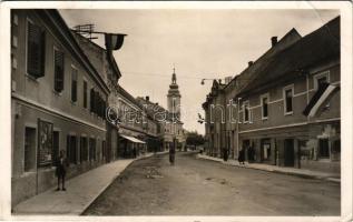 1942 Csáktornya, Cakovec; utca, templom, Berger Simun üzlete, bicikli, magyar zászló. Balkányi Lajos kiadása / street, church, shops, bicycle, Hungarian flag (EB)