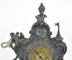 Asztali óra romantikus stílusban, nőalak, galambok, vártorony figurális díszítéssel. Ón, XIX. sz. In...