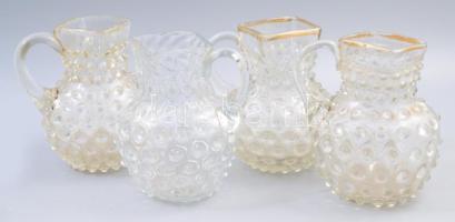 4 darab bütykös kancsó. Zempléni huták, 19. sz. időszakai, közte kopott aranyozással, m: 13 cm alatt /// Set of 4 knobbed jugs. Zemplén glassworks, 19th century periods, some with worn gilding, all under 13 cm in height.
