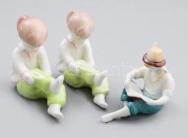 3 db Aquincumi és Hollóházi figurális porcelán: öltözködő kislány, olvasó fiú kézzel festettek, jelzettek, hibátlan m: 11 cm