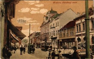 Miskolc, Széchenyi (tévesen: Szécshenyi) utca, Takarékpénztár, Boholy Imre és Kovács üzlete, Apollo színház, Neumann József tűzifa reklám, villamos. Fischer tőzsde kiadása (EK)