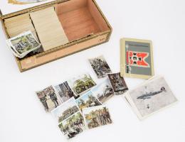 cca 1930 Vegyes cigaretta gyűjtői kép gyűjtemény, több száz darab, a nagy részén a német hadsereget ábrázoló képekkel, sérült fadobozban.