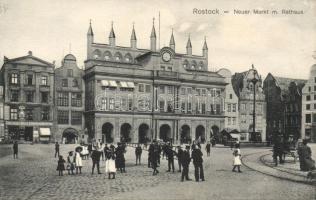 Rostock town hall with gas lamp and smoked fish shop