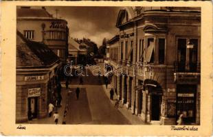 Léva, Levice; Mussolini utca, Grünhut S., Róth üzlete, fodrászat. Schulcz Ignác és Fia kiadása / street, shops, hairdresser's (EK)