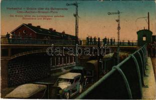 1915 Herbesthal, Brücke über die Bahnstrecke Cöln-Aachen-Brüssel-Paris. Verlag Ferd. Schweitzer / railway bridge, automobile, on the border of Germany and Belgium + "Feldpostexpedition Infanterie-Division" + "Brief-Stempel 1. Batterie Manst. Feldartillerie-Regiment No. 75." (worn edges)