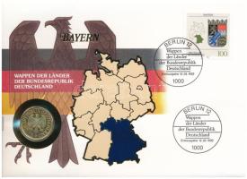 Németország 1991D 1M aranyozott Cu-Ni, tartományi címereket ábrázoló bélyeggel felbélyegzett "BAYERN" borítékban, bélyegzéssel, német nyelvű leírással T:UNC Germany 1991D 1 Mark gilt Cu-Ni in "BAYERN" envelope with stamps depicting provincial coats of arms and cancellation, with German description C:UNC
