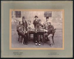 cca 1920 Katonatisztek és civil urak csoportképe asztalnál, sakktáblával, dominóval, borosüvegekkel, kartonra kasírozott fotó Schäffer Ármin udv. fényképész budapesti műterméből, hátoldalán ragasztónyomokkal, 11x15,5 cm, karton: 17x22 cm