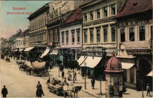 1908 Kolozsvár, Cluj; Mátyás király téri részlet, Püspöky Miklós harisnya kötödéje, Rácz János, Telcser Testvérek, Reményik L. és Fiai üzlete, Iparbank részvény társaság, M. kir. államvasutak szállító hivatala, Ferenczi cipészmester, hirdetőoszlop, Kereskedelmi bank / main square, street view, bank, shops (EK)