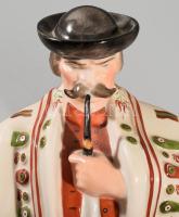 Herendi pipázó juhász, magyar trikolor ruhában. Jelzett, kézzel festett, hibátlan, m: 33 cm