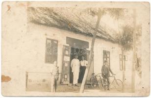 1921 Sopron, Aranyos Ferenc vegyeskereskedése, férfi kerékpárral. photo (lyukak / pinholes)