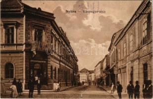1917 Nyitra, Vármegye utca, gyógyszertár, üzlet, Singer varrógép reklám. Huszár István kiadása / street view, shop, pharmacy, advertisement (szakadás / tear)