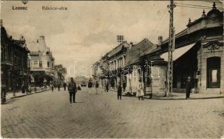 1916 Losonc, Lucenec; Rákóczi utca, hirdetőoszlop, üzletek, rendőr / street view, advertising column, shops, policeman (Rb)