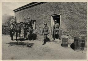 Military WWII the SS searching over a Polish house