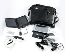 Táskában 2 darab elektromos töltő, közte A-solar Titan (AM600) napelemes notebook töltő.