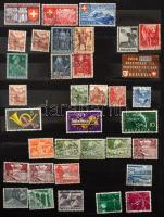 Svájc kb 640 db bélyeg 12 vastag fekete lapos A4-es berakóban, tokkal