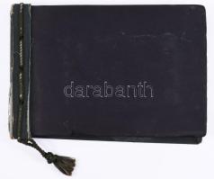 cca 1929-1934 Régi fotóalbum vegyes családi képekkel, összesen kb. 87 db beragasztott fotóval, harántalakú egészvászon-kötésben, sérült, hiányos borítóval, 17,5x25 cm