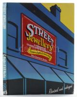 Christopher Baglee - Andrew Morley: Street Jewellery. A History of Enamel Advertising Signs. London, 1988, New Cavendish Books. Gazdag képanyaggal illusztrálva. Angol nyelven. Kiadói egészvászon-kötés, a borítón zománcozott fém táblával, kissé kopottas borítóval és gerinccel.