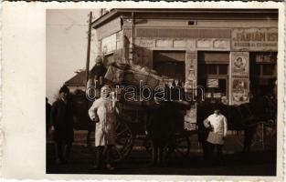 Hajdúböszörmény, Ifj. Fábián István fűszerüzlete, előtte megrakott szekér, férfi álarcban. photo