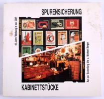 Spurensicherung 40 Jahre Werbung in der DDR. Kabinettstücke aus der Sammlung Ute und Michael Berger. Frankfurt am Main,1990,Deutscher Werbemuseum. Német nyelven. Gazdag képanyaggal illusztrált. Kiadói papírkötés, foltos borítóval.