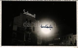 Constanta, Konstanca; Schmoll pasta, Firestone, Garaj Unirea, Socec &amp; Co. shops, advertisement at night. Lupu&amp; Bartha photo