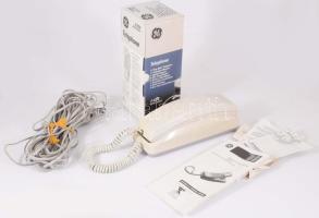 Vezetékes telefon, papírjával, dobozában.