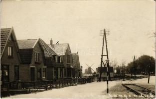 Broek op Langedijk, street, windmills, railway. photo