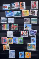 Svájci tétel, benne kb 640 db bélyeg 12 fekete lapos A4-es berakóban, tokkal