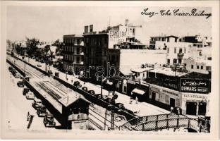 1957 Suez, The Cairo Ralway, automobiles, S'James's Bar, Restaurant and Grill, Dewar's Whisky, Cognac Martell advertisements, The Pyramids Bazaar